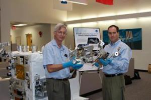 NASA Goddard RRM manager Justin Cassidy (right) and Ken Kremer manipulate RRM experiment tools.  Photo credit: Ken Kremer