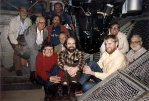 James Gunn (center), James Westphal (far right), and their team inside the Hale Telescope’s Cassegrain cage with Four-Shooter, the prototype for the Hubble Space Telescope WFPC camera, c. 1984. (Credit: J. Gunn)
