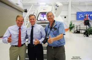 ‘Thumbs Up’ for Boeing CST-100 space taxi at the Kennedy Space Center. Florida’s US Sen. Bill Nelson (left), final shuttle commander Chris Ferguson (now Director of Boeing’s Crew and Mission Operations, center) and Ken Kremer pose in front of capsule with stairway leading to open hatch. Credit: Ken Kremer