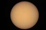 A single 1/1250-second exposure (ISO 1600) taken at 11:10am EDT using 3.5" Questar and a Baader solar filter (false color) by Robert Vanderbei