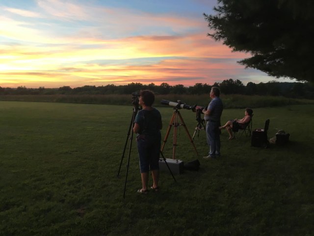 Seraphine Allen, Bill Murray and Jen Skitt waiting for a darker sky. Credit: Gene Allen
