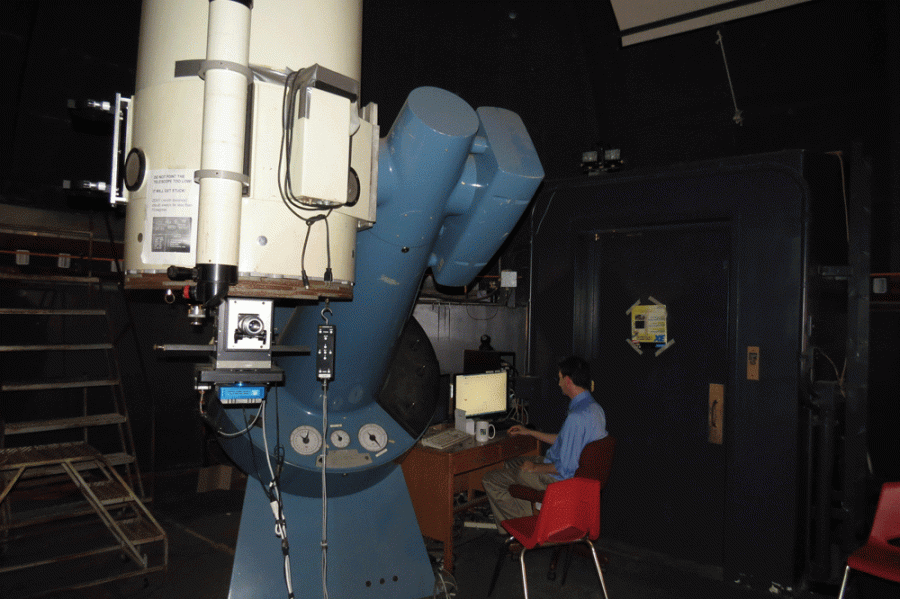 Dr Reichart with the 24” Perkin-Elmer telescope in the dome at Morehead Planetarium, UNC.